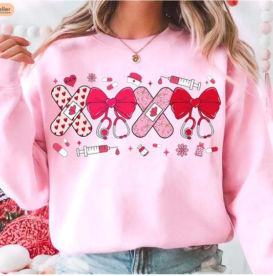 XOXO Nurse Valentine Sweatshirt – Pink Bow & Bandage Graphic Pullover